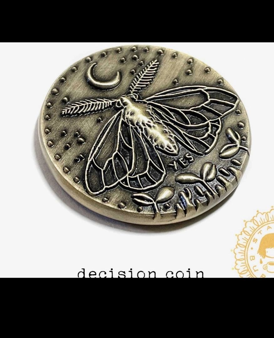Moneda de decisiones dorada